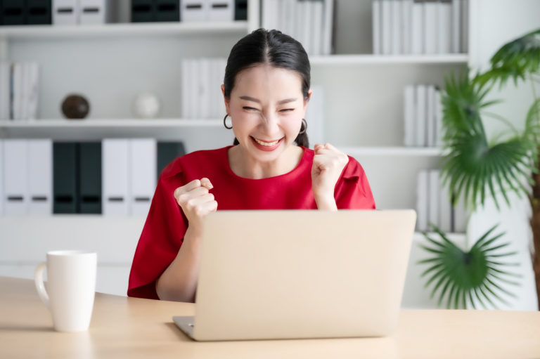 Excited female feeling euphoric celebrating online win success achievement result, young woman happy about good email news, motivated by great offer or new opportunity, passed exam, got a job